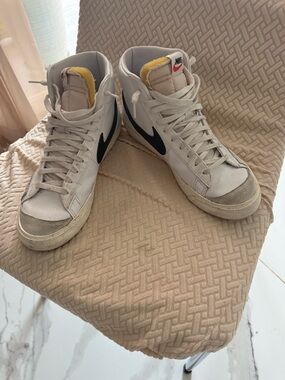 Nike White Sneakers with Red Swoosh and Yellow Tongue Detail